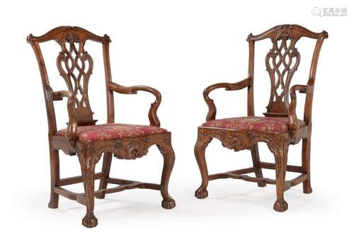 A PAIR OF CARVED WALNUT OPEN ARMCHAIRS, PROBABLY PORTUGUESE,...