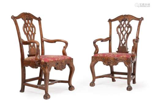 A THIRD PAIR OF CARVED WALNUT OPEN ARMCHAIRS PROBABLY PORTUG...