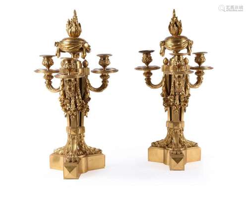 † A PAIR OF GILT BRONZE THREE-LIGHT CANDELABRA, IN LOUIS XVI...