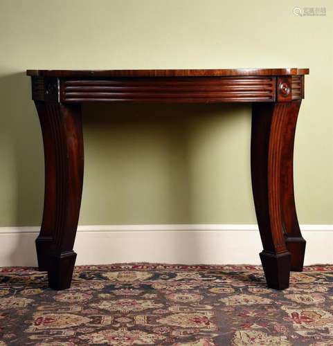 A REGENCY SERPENTINE MAHOGANY SIDE TABLE, IN THE MANNER OF M...