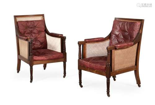 A PAIR OF MAHOGANY LIBRARY BERGERE ARMCHAIRS, IN REGENCY STY...