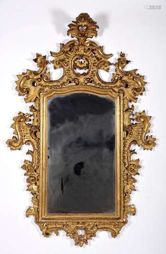 A mirror, carved and gilt wood, Spanish, 18th C., small rest...