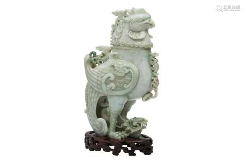 A CHINESE APPLE-GREEN JADEITE 'DRAGON AND PHOENIX' V...
