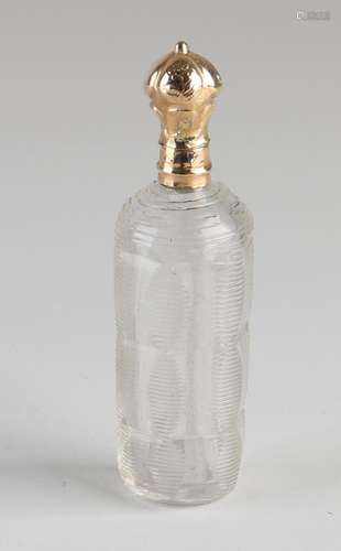 Odeur bottle with golden cap