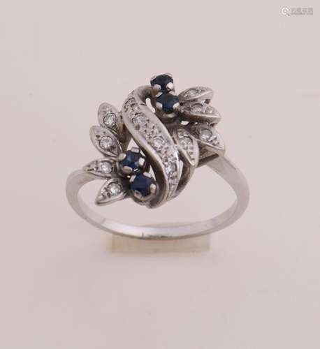 White gold ring with diamond and sapphire