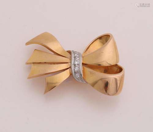 Gold brooch with diamond, bow