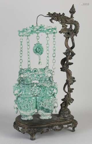 Bronze holder with jade pendant, H 47 cm.