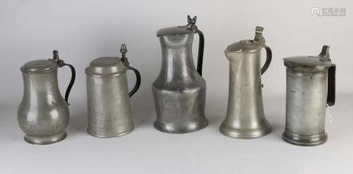 Five antique pewter valve jugs