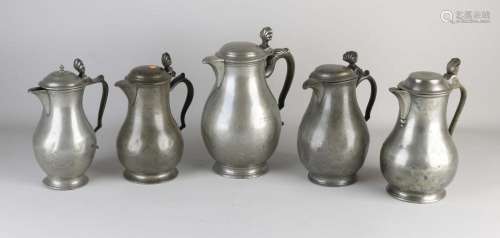 Five antique pewter valve jugs