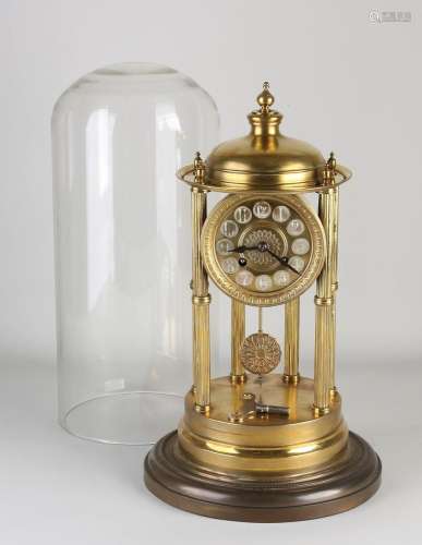 Antique mantel clock under a bell jar, 1900