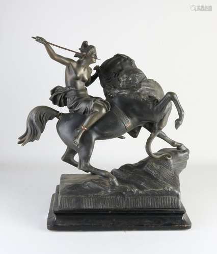 Antique figure, Amazon fighting lion