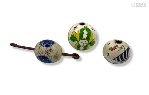 A lot of three Kutahya egg shaped pottery hanging ornaments