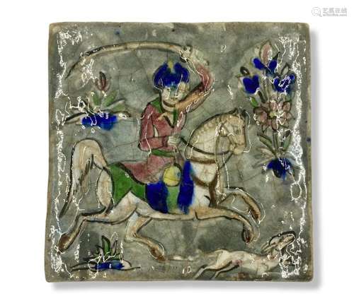 A 19th century Persian Qajar polychrome, glazed tile