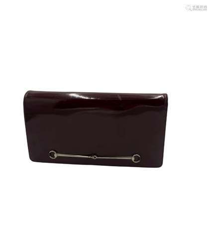 Gucci - a leather clutch bag