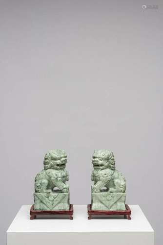 PAIR OF LIONS ON PEDESTALS