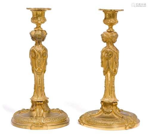 A PAIR OF BRONZE CANDLESTICKS