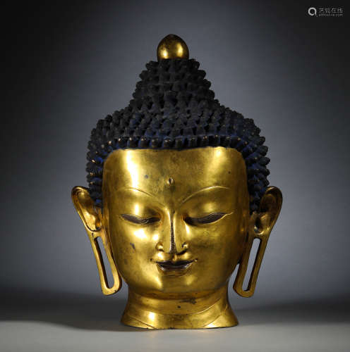 In the Qing Dynasty, the bronze gilded Buddha head