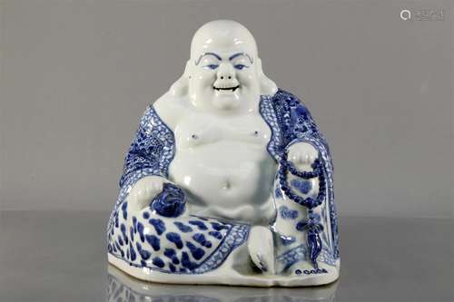 A Blue And White Figure Of Maitreya