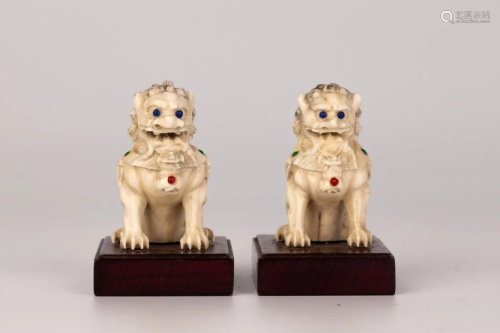 A Pair of Ivory Carved Lions