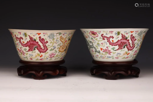 A Pair of Famille Rose Bowls with Recumbent Dragons and Flow...