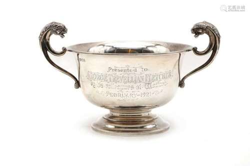 A silver twin handled pedestal cup