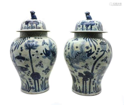 A pair of Chinese blue and white vases and covers,