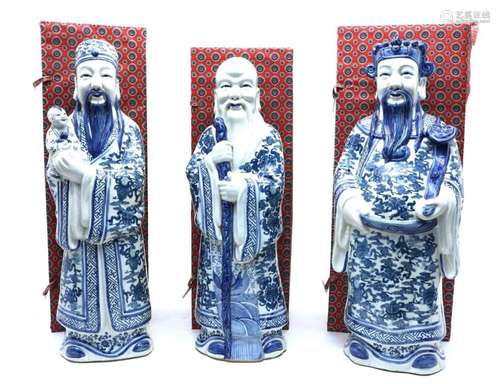 A collection of three Chinese blue and white house gods,