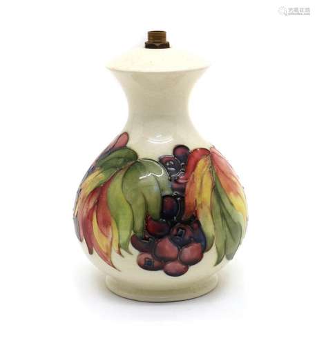 A Moorcroft pottery 'Leaf and Berry' pattern lamp ba...