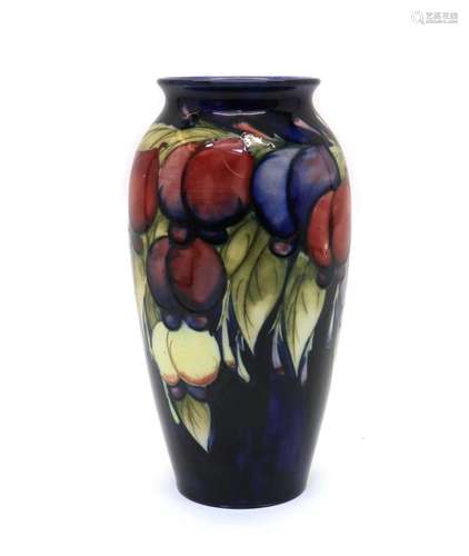 A William Moorcroft pottery Wisteria pattern vase,