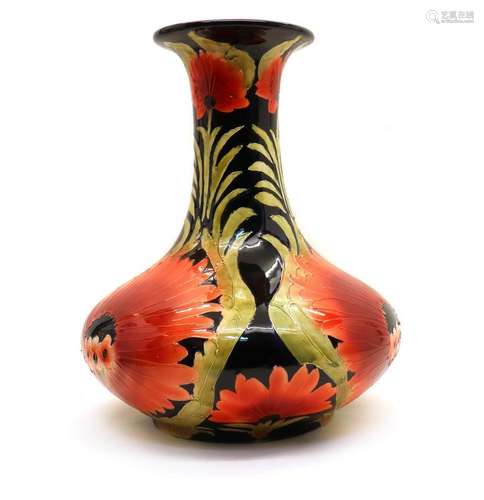 A large Moorcroft style pottery vase,