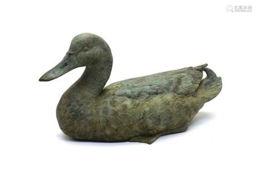 A bronzed model of a duck