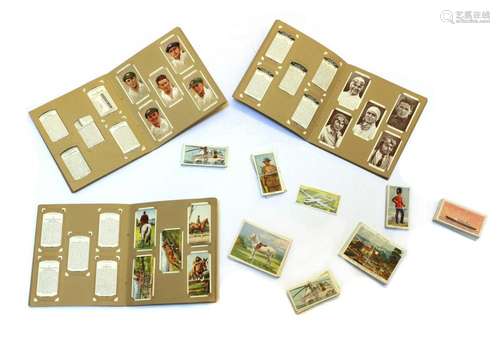 A collection of cigarette cards and trade cards,