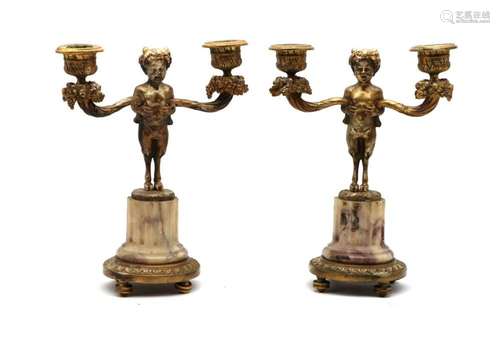 A pair of gilt metal and onyx candelabra