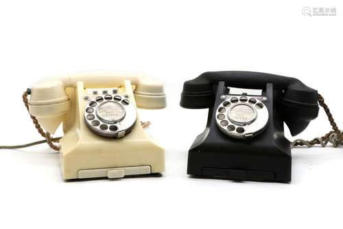 A pair of bakelite telephones,