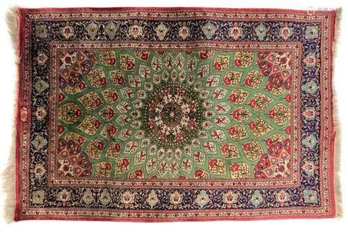 A signed silk Qum rug,