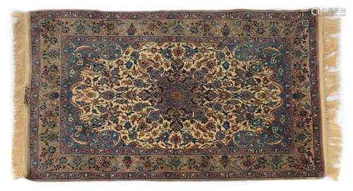 A signed wool and silk Isfahan rug,