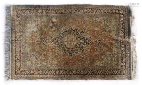 A Persian silk rug,