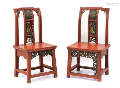 A near pair of red lacquer low chairs