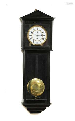 An ebonised regular wall clock,