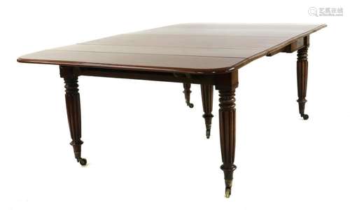 A mahogany drop flap extending dining table