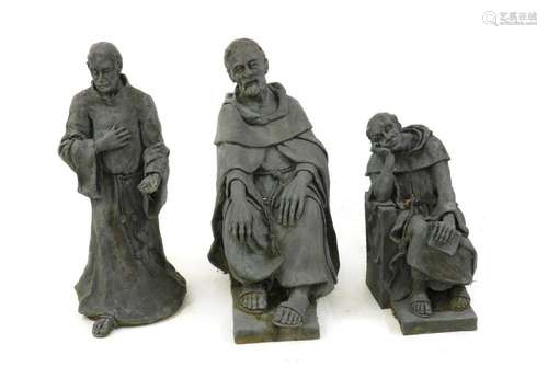 Three sculptures of Cistercian monks,