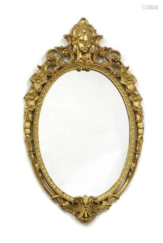 A French Empire style gilt brass oval wall mirror,