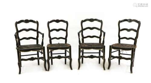 A set of four continental ebonised chairs,