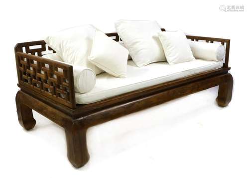 A modern Asian teak daybed,