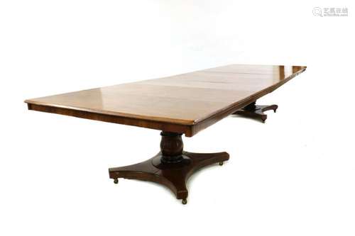 A William IV and later mahogany extending dining table