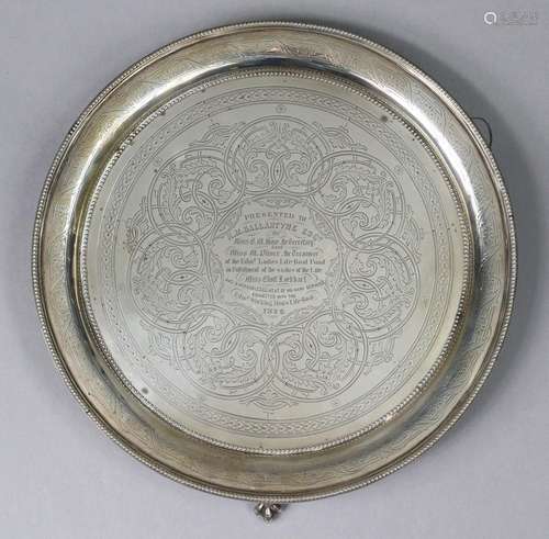 A Victorian silver salver with beaded rim to the raised bord...