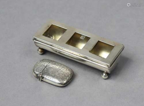 An Edwardian silver three-division postage stamp box, the tr...