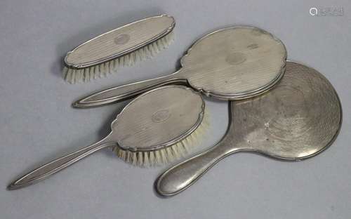 An engine-turned silver mounted hand mirror, hair brush, &am...