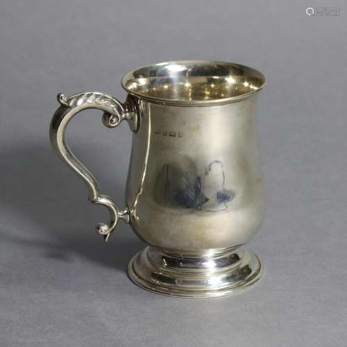 A silver tankard in the late 18th century style, of baluster...