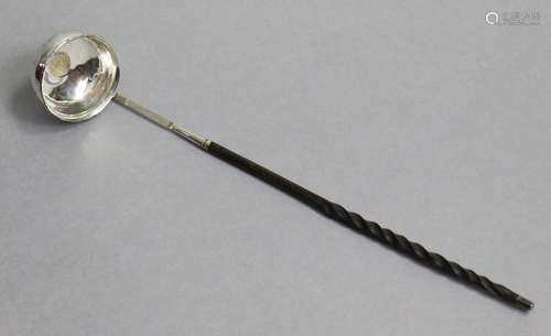 An 18th century punch ladle, the circular bowl fashioned fro...